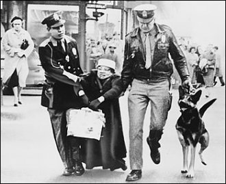 authorities drag Ruth Tinsely far from a Richmond shop, 1960