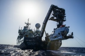 the study vessel Atlantis with all the submersible Alvin dangling down its stern.